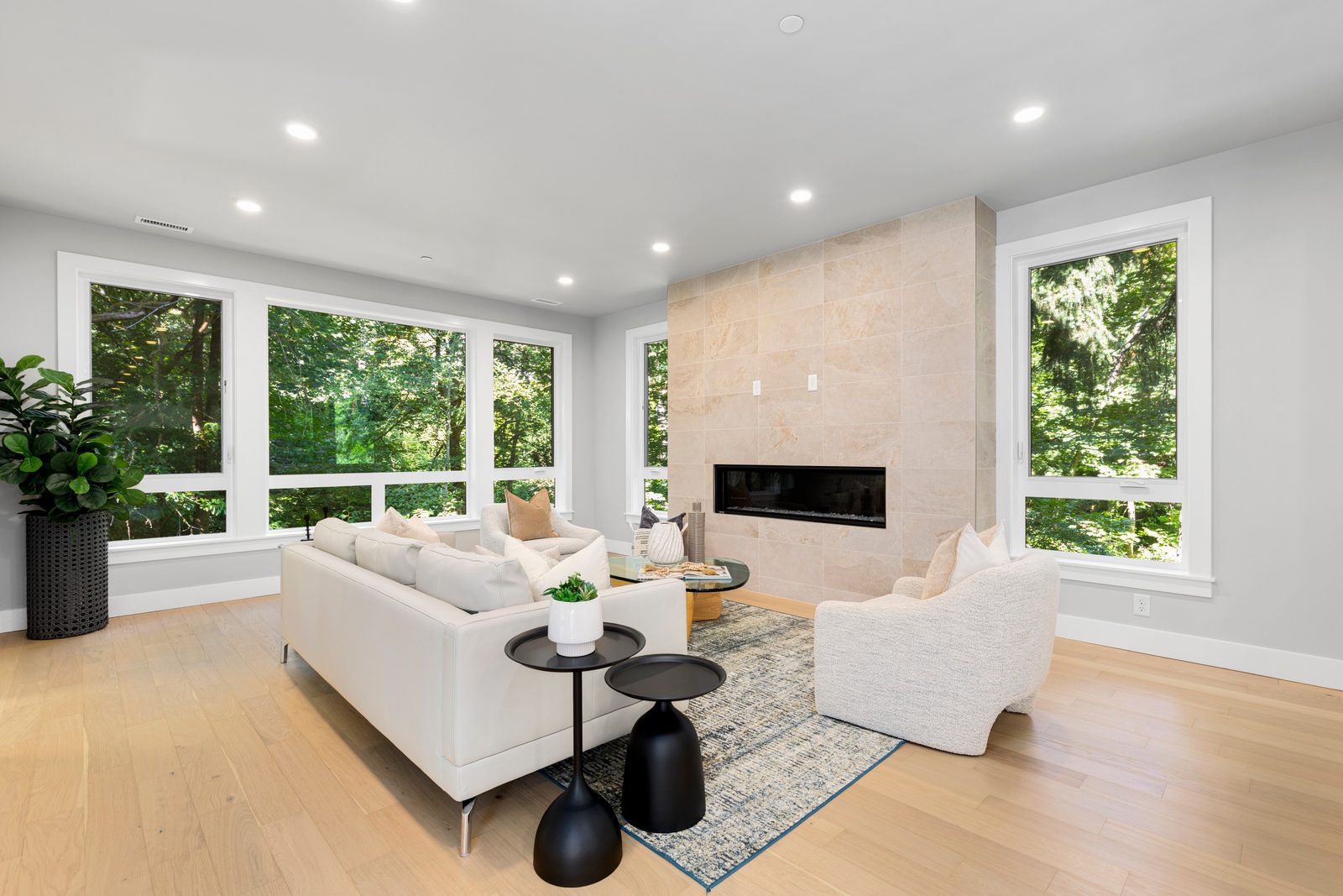 Expansive living area framed by oversized windows