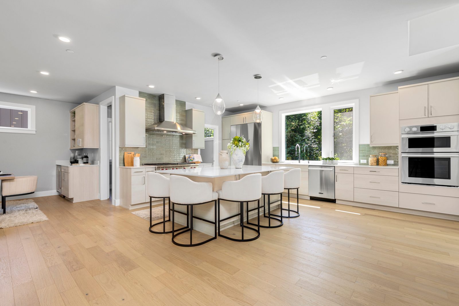 Designer kitchen featuring a large island, premium appliances, and abundant storage.