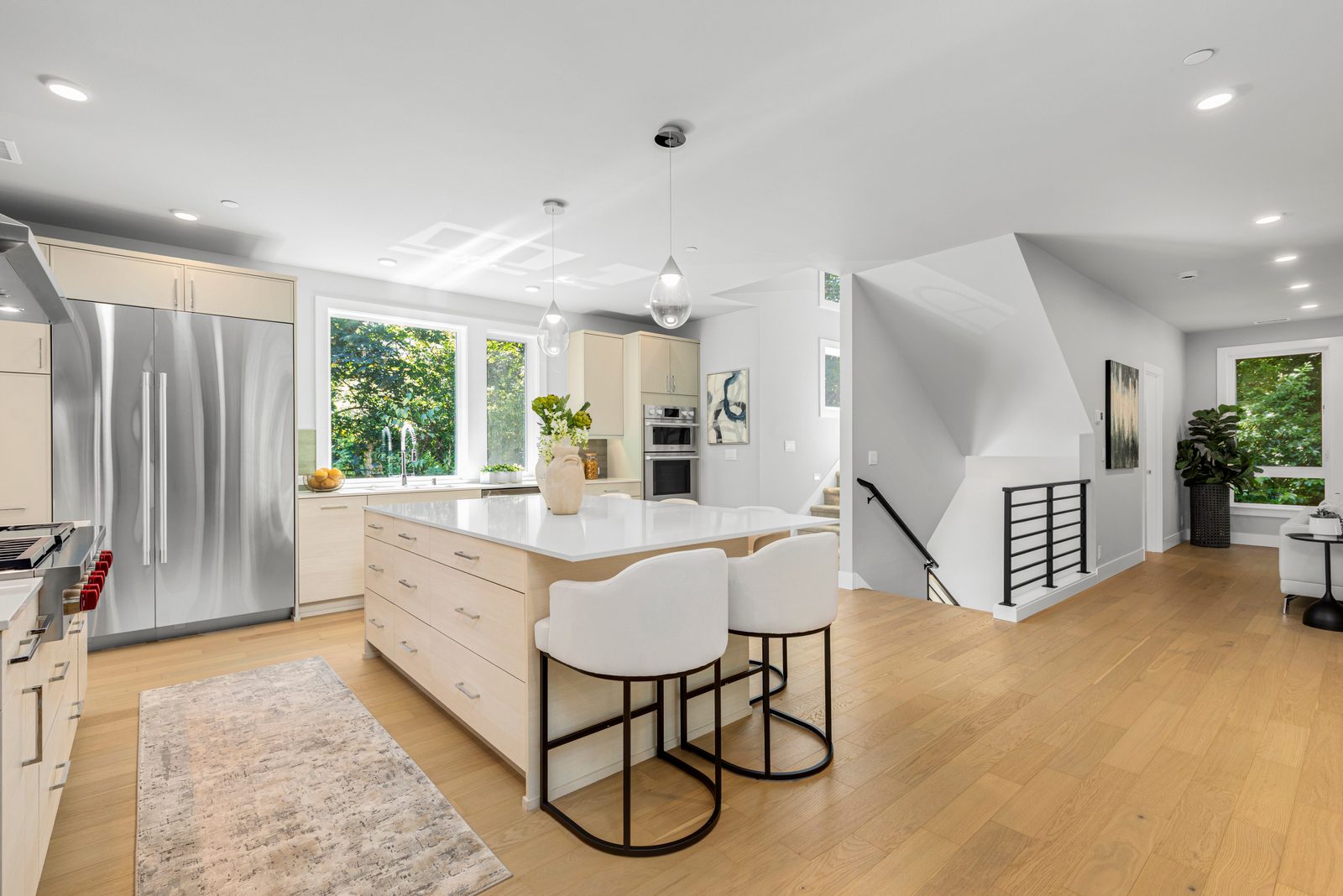 Bright kitchen with oversized island and easy access to the covered outdoor living area.