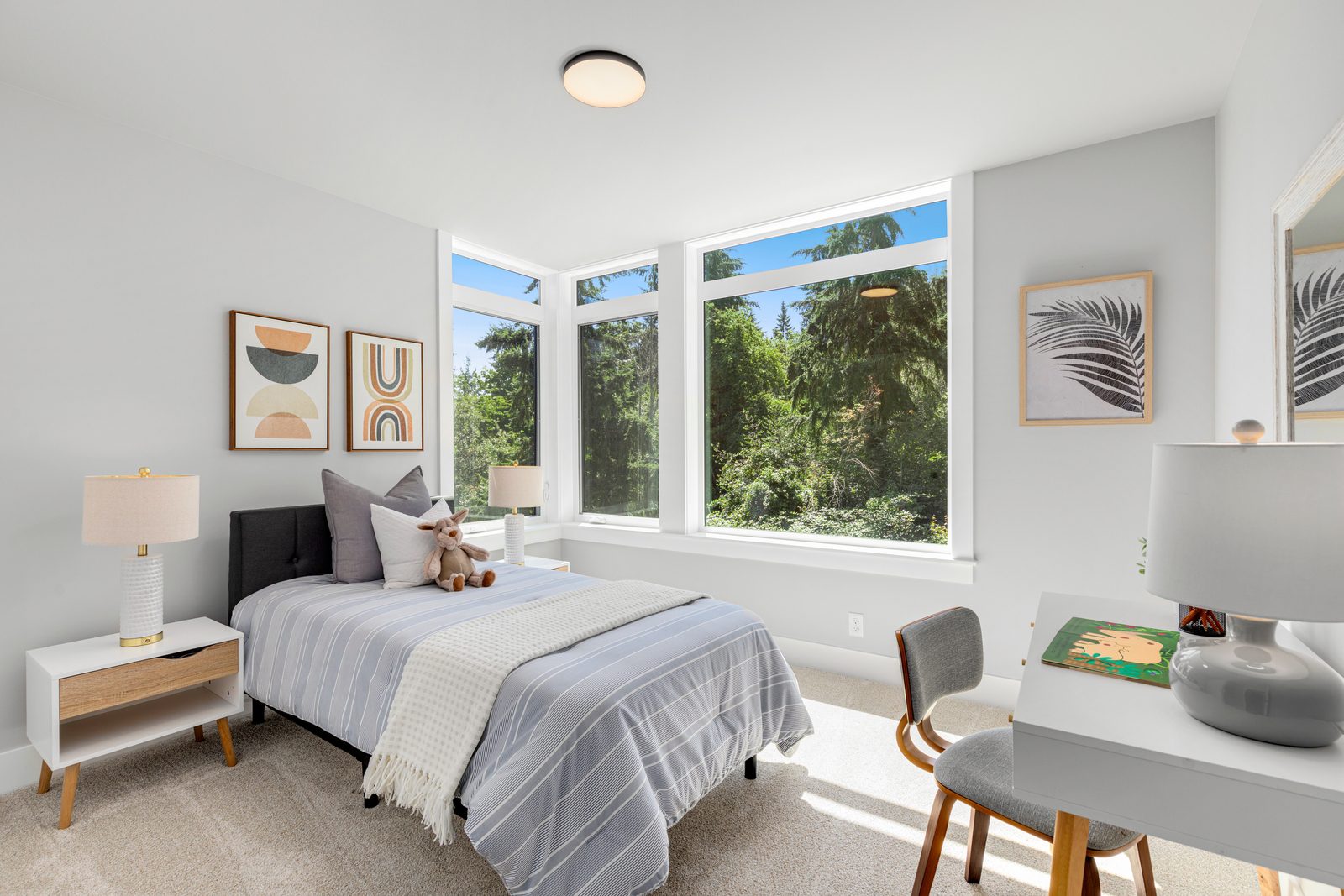 Comfortable bedroom with large windows