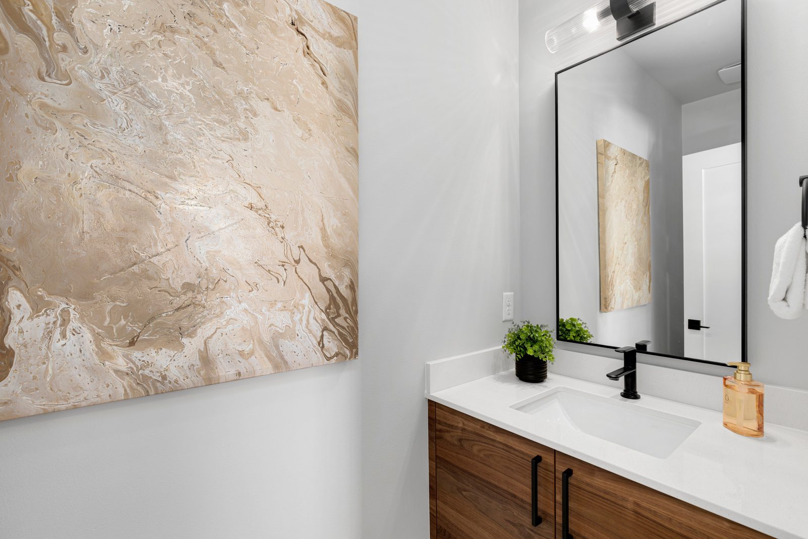 Elegant powder room with clean design.