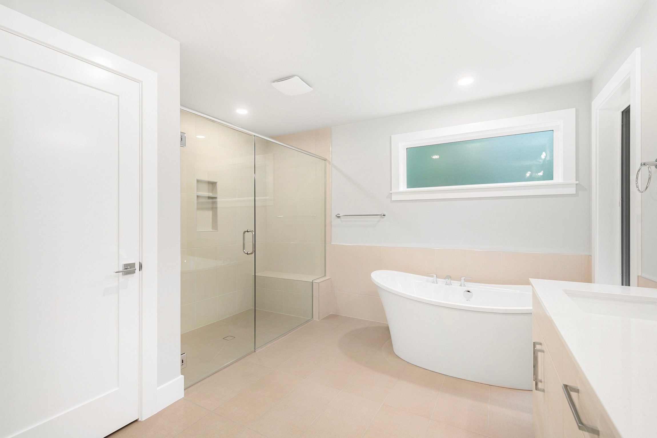 Spa-inspired primary bath with freestanding soaking tub