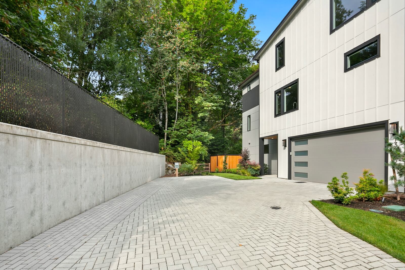 Private entry framed by lush, protected native landscaping