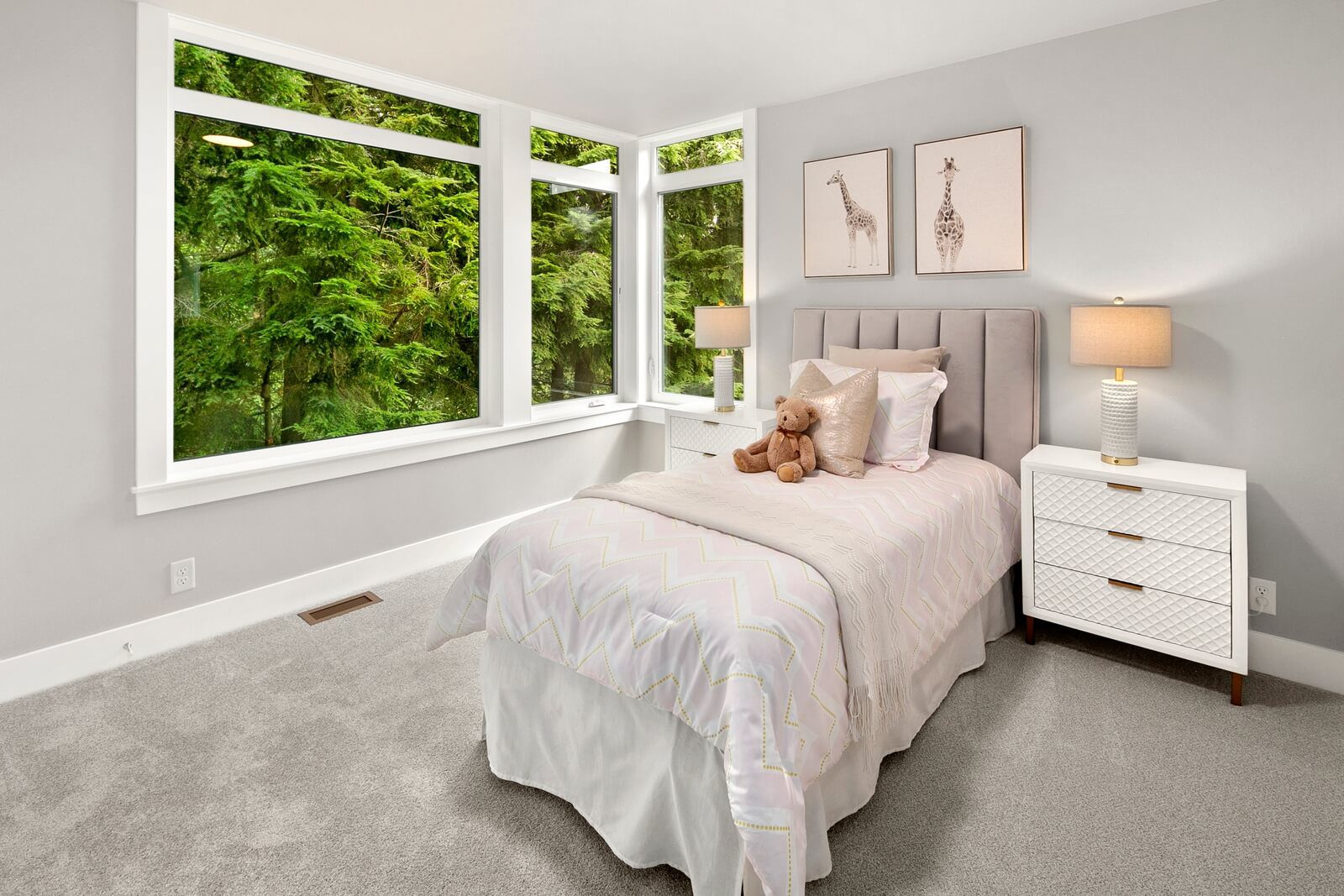 Charming bedroom framed by beautiful Northwest greenery