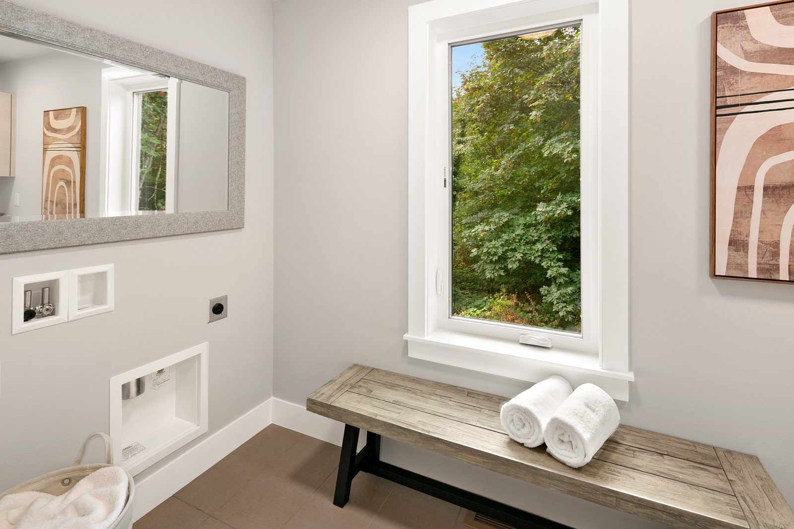 Bright laundry room with natural light and space