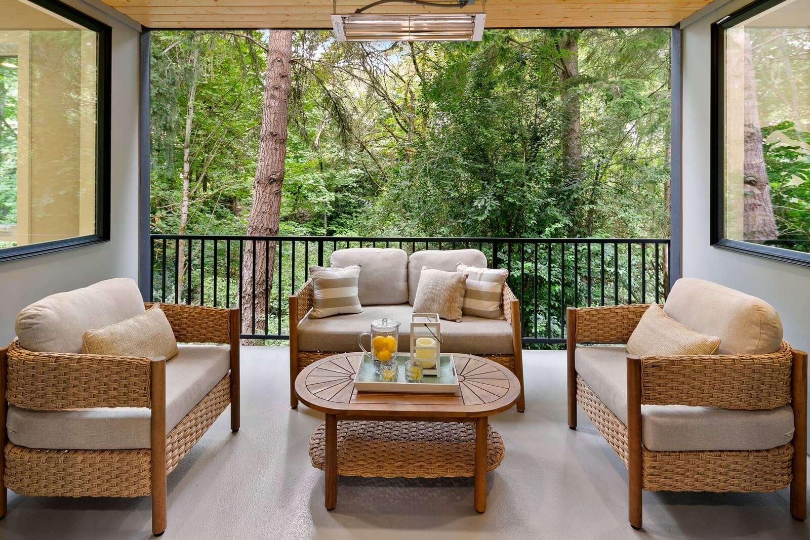 Inviting covered outdoor living space surrounded by mature trees